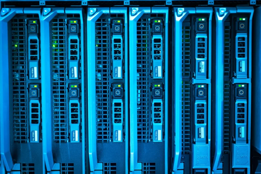 Rows of illuminated server racks in a data center, the kind of computing power used to train large AI models