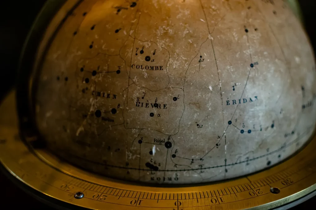 Close-up of an antique celestial globe marked with constellations, the kind of tool used by Renaissance astrologers