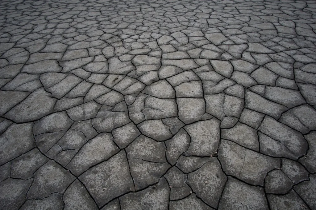 Aerial view of dry, deeply cracked ground with no plants, as Earth's surface may look once the oceans are gone