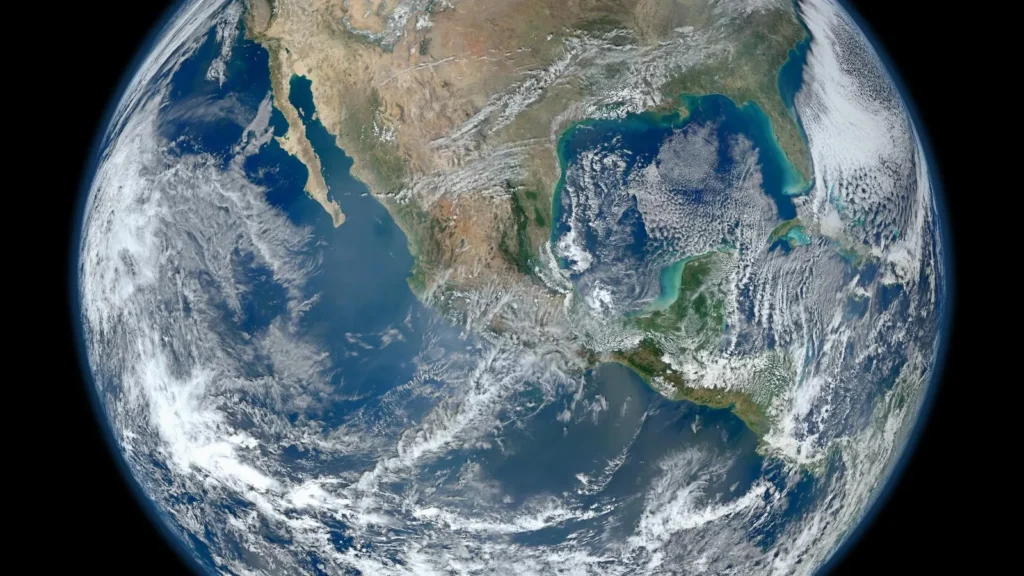 Planet Earth seen from space, showing North America under swirling white clouds