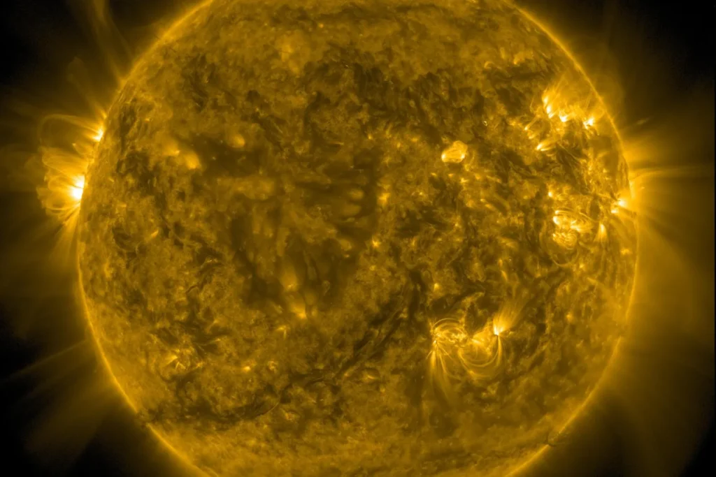 The Sun glowing gold in extreme ultraviolet light, photographed by NASA's Solar Dynamics Observatory